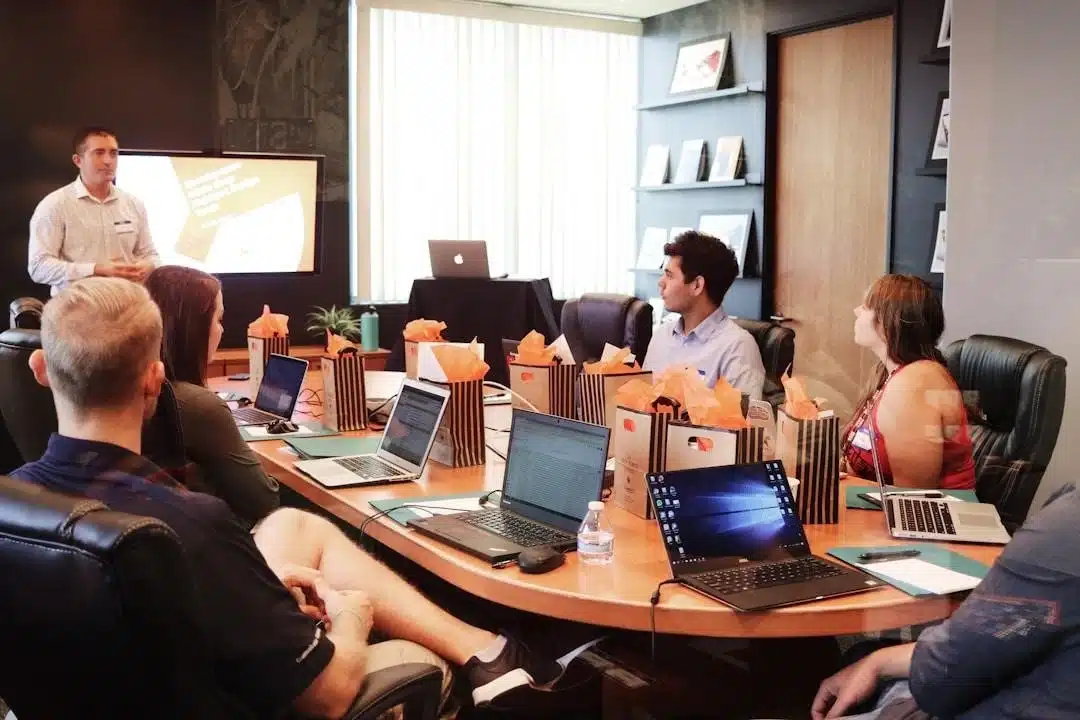 A team in an office discussing RFP automation during a meeting